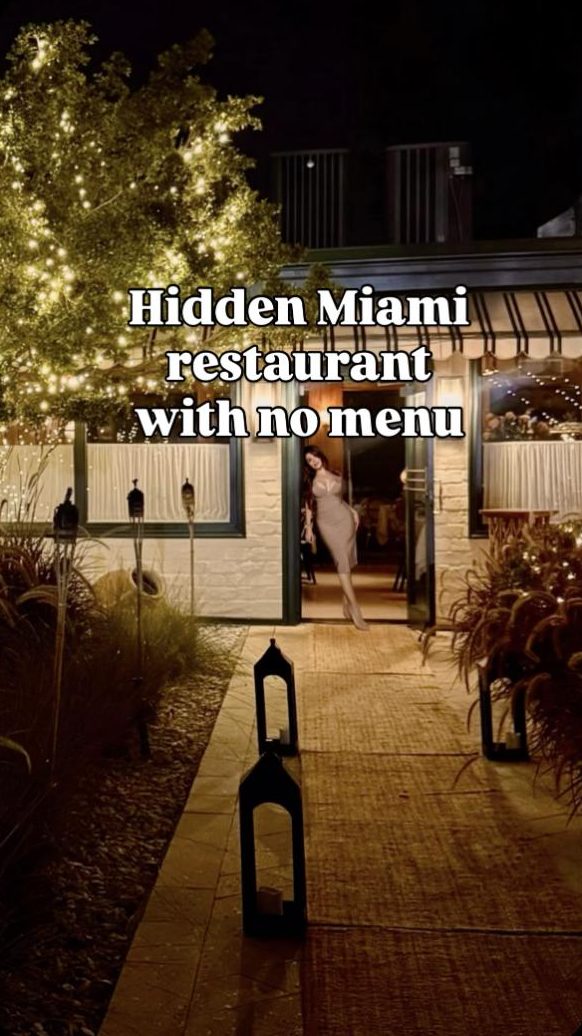 Hidden garden entrance at San Lorenzo, lit at night
